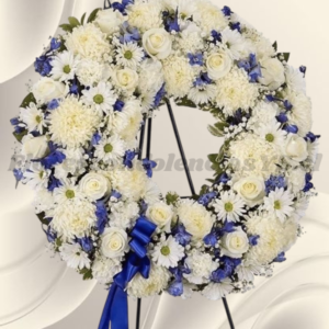 Corona claridad en mix flores de temporada y lindo lazo